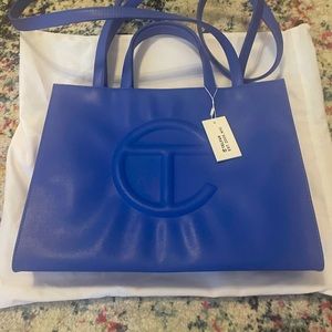 Brand new with tags, never used, medium sized Telfar bag.